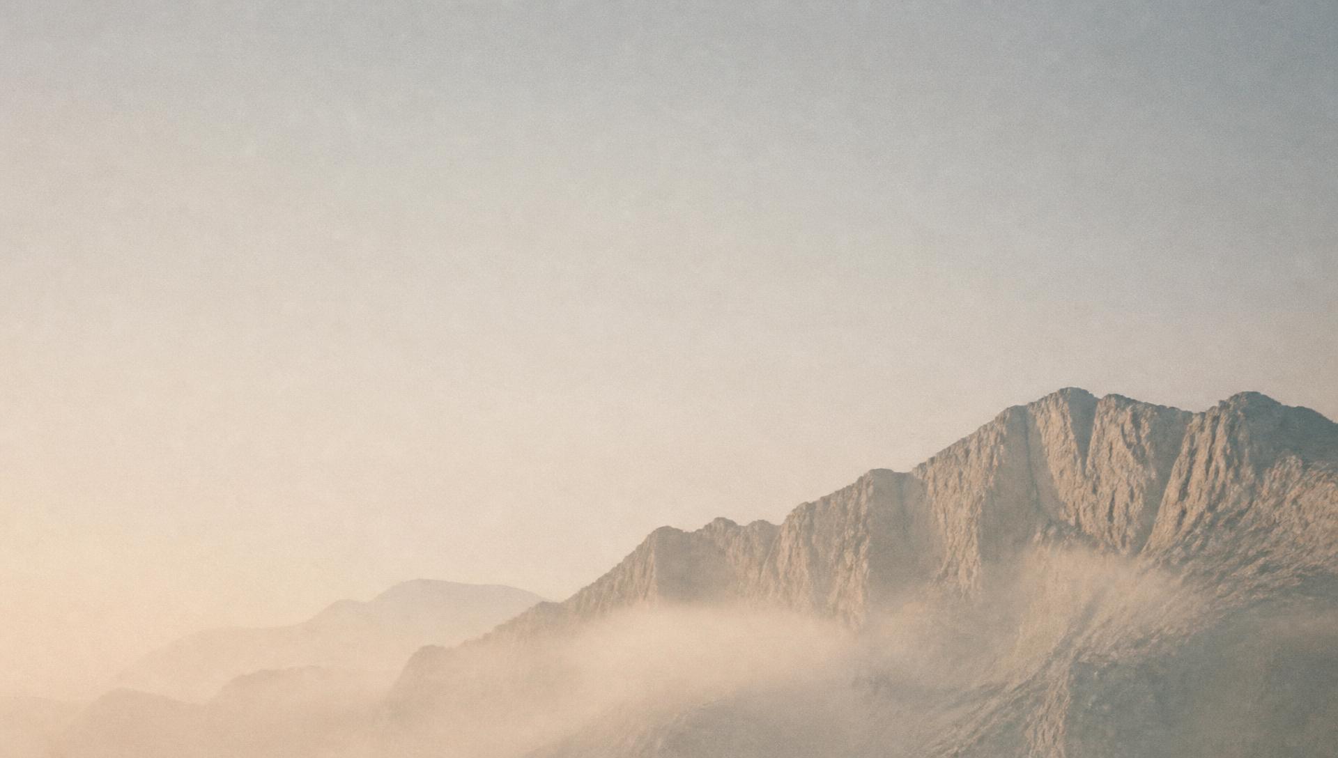 Mist over an alpine ridge at dawn